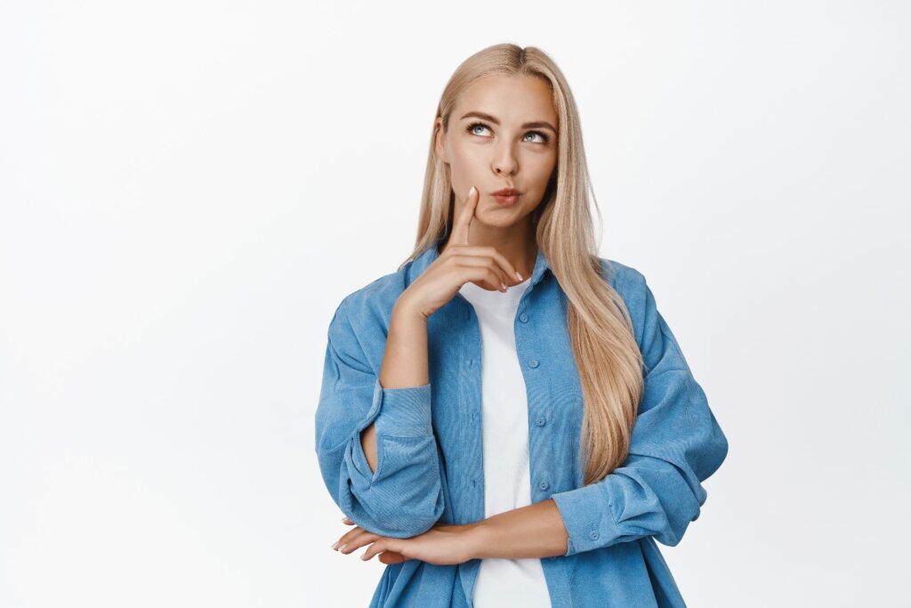 portrait silly blond girl thinking looking aside thoughtful standing white woman ponder something 1